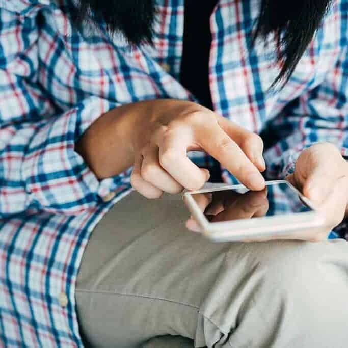 Close up of young woman using a cell phone